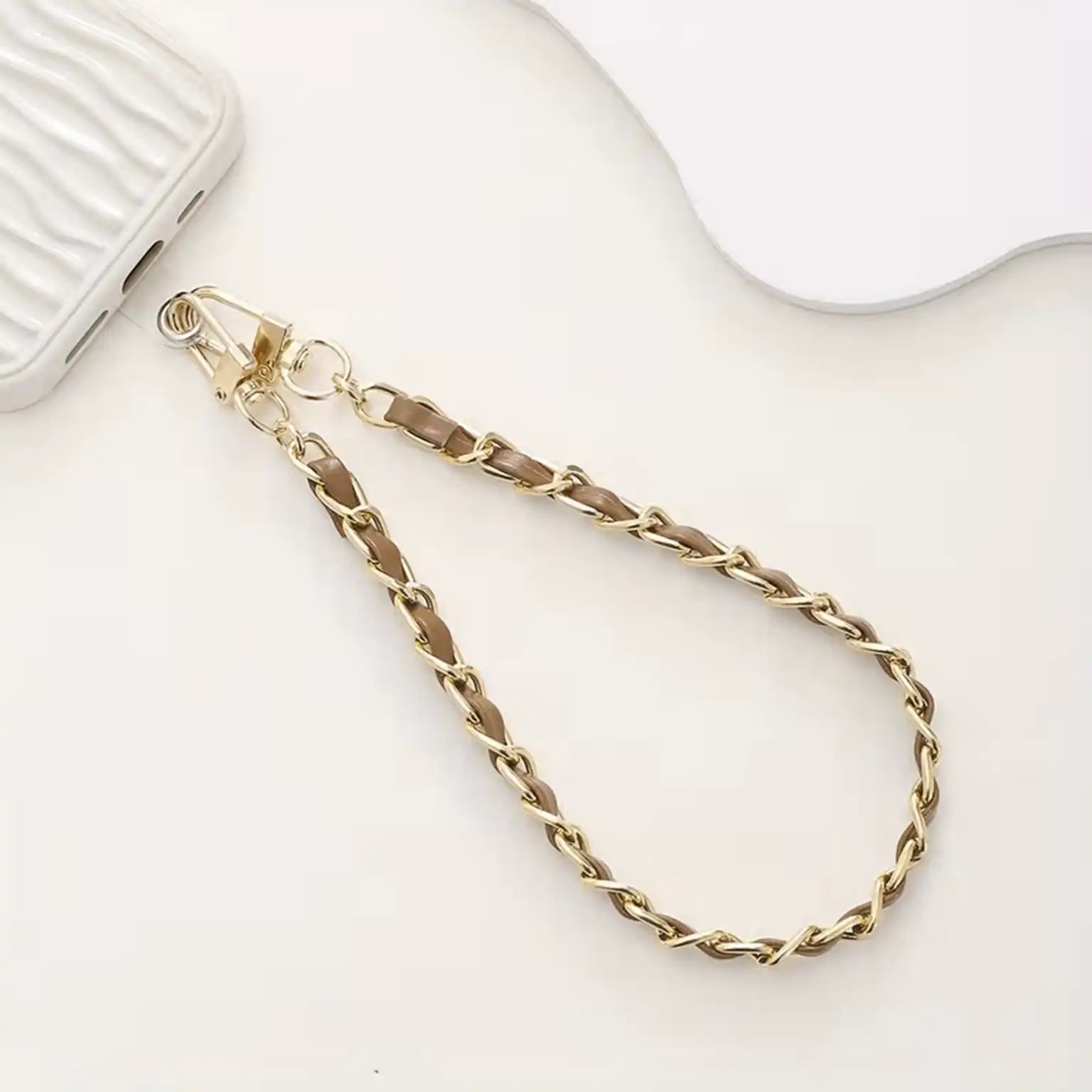 Gold chain strap on a white background