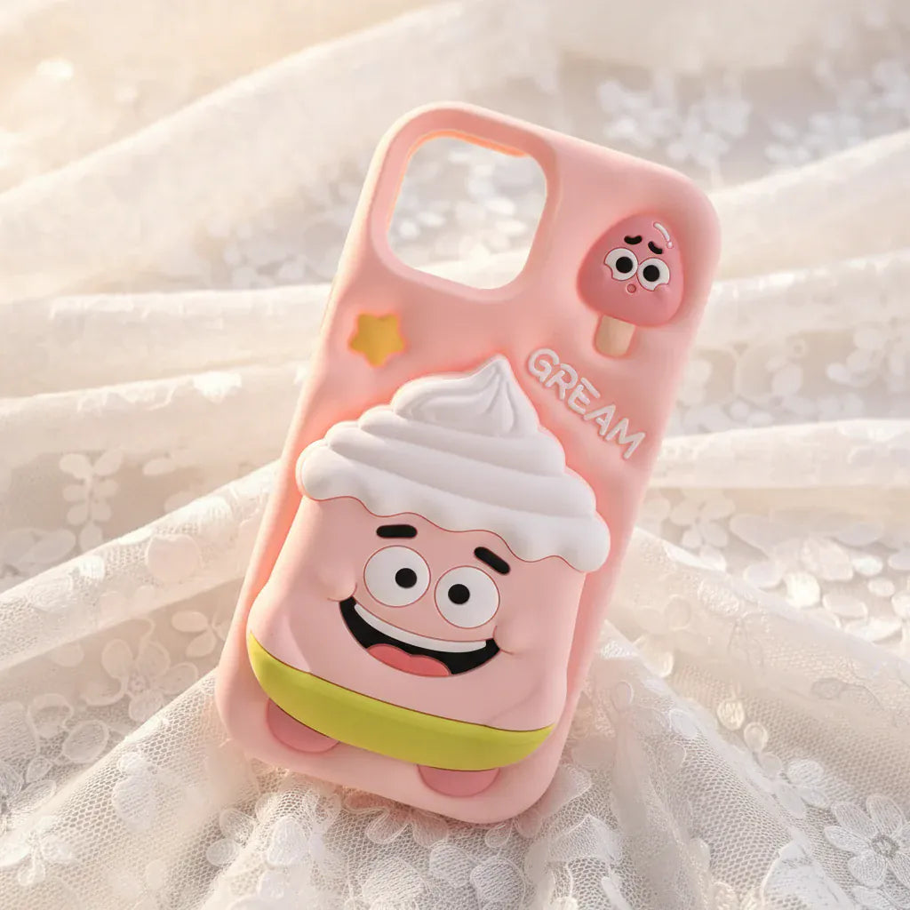 Phone case with cartoon ice cream design held by a hand outdoors.