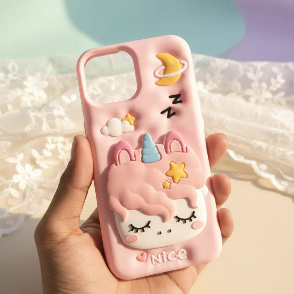 Pink unicorn phone case held in a hand with a blurred outdoor background
