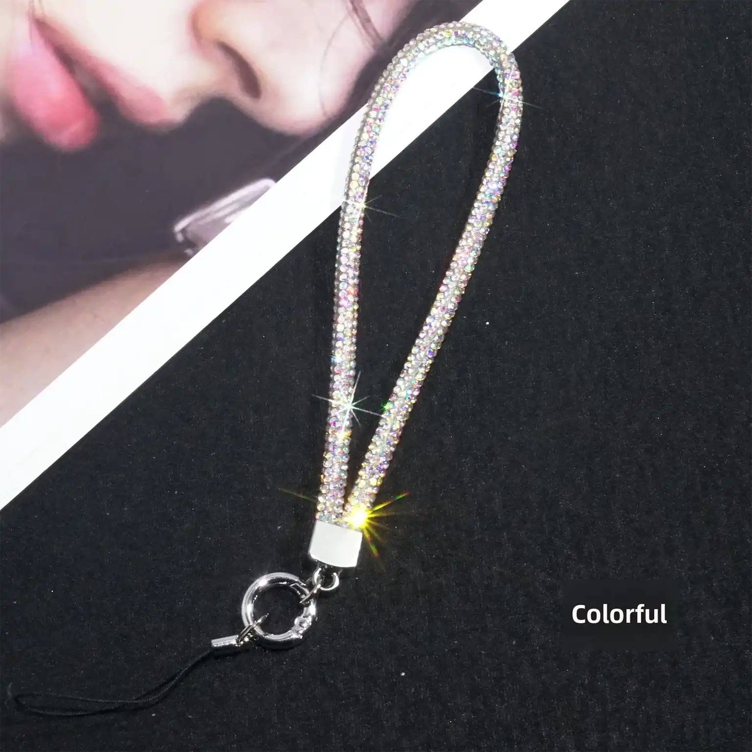 Sparkly lanyard with a clip on a black background